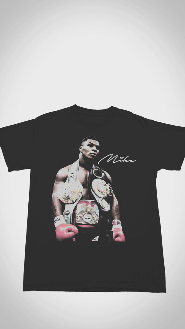 Vintage Mike Tyson 'Iron Mike' T-shirt - Close-up video shows heavyweight 100% cotton, distressed 1980s fight graphics, and authentic 'Baddest Man on the Planet' text for boxing collectors.