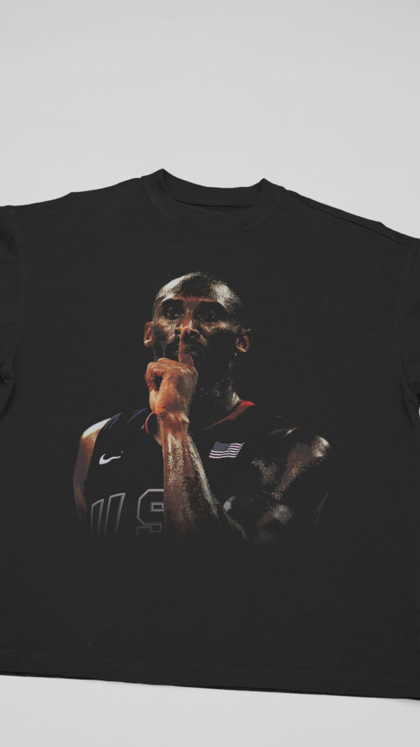 Kobe Bryant 'SHHH' Finger Tribute T-shirt - Close-up video shows heavyweight cotton, distressed 2006 playoff finger-to-lips graphic, and '81-Point Game' sleeve text for hardcore Mamba collectors.