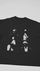 Official Metro Boomin 'We Still Don't Trust You' T-shirt - Close-up video shows heavyweight black cotton, cracked 'Heroes & Villains' sequel graphics, and double-stitched seams for trap authenticity.