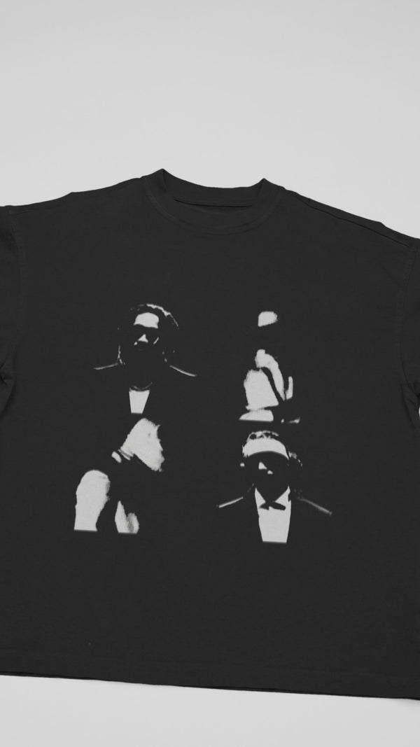 Official Metro Boomin 'We Still Don't Trust You' T-shirt - Close-up video shows heavyweight black cotton, cracked 'Heroes & Villains' sequel graphics, and double-stitched seams for trap authenticity.